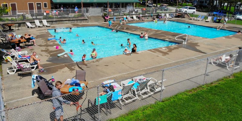 An aerial view of a swimming pool at an RV park.